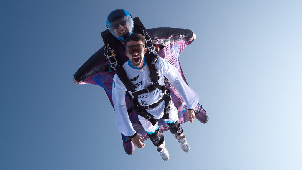 Wingsuit baptism with man in white